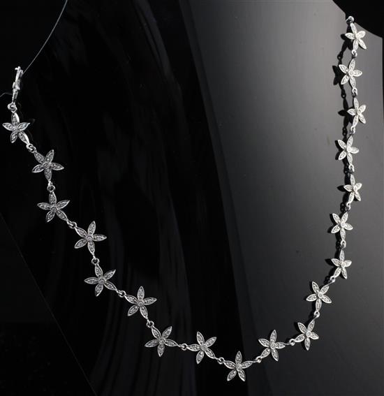 An 18ct white gold and diamond necklace, 14.5in.